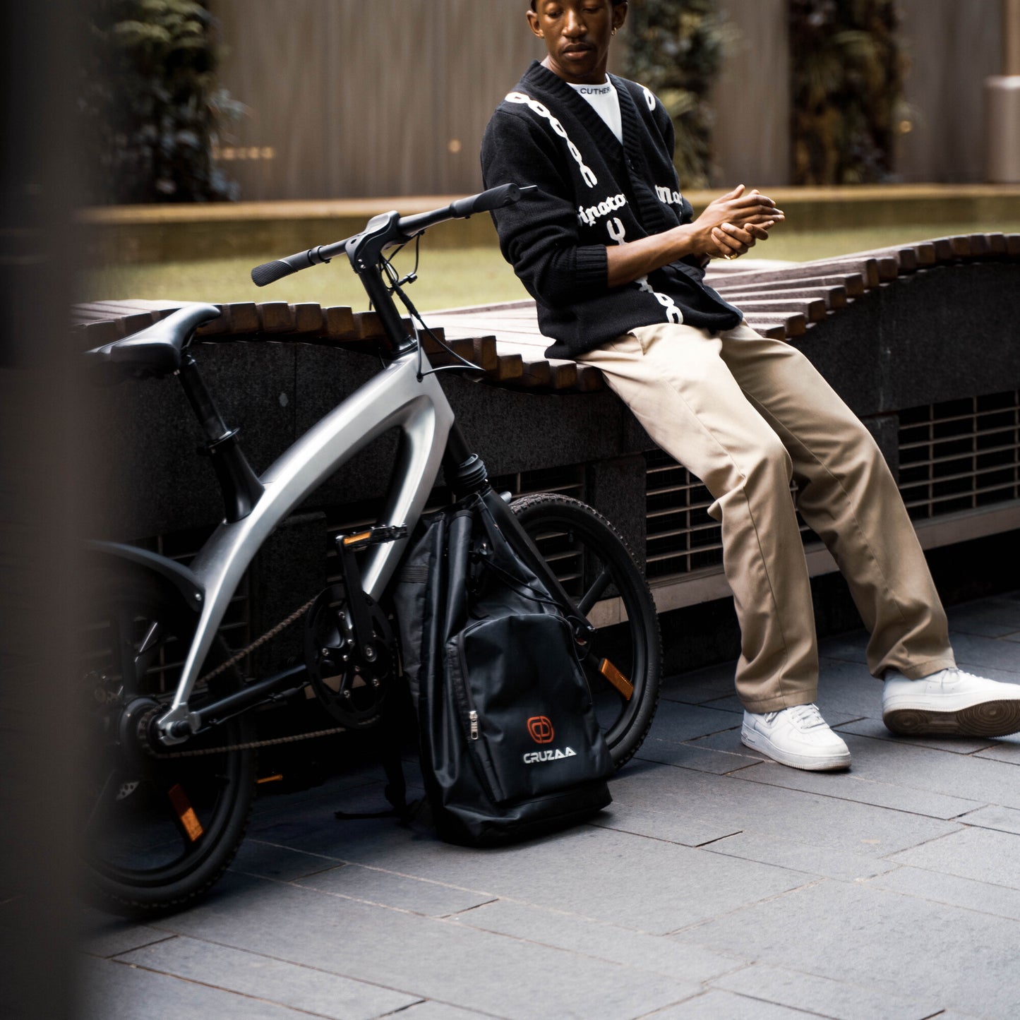 Cruzaa Carbon Black Electric Bike Waiting