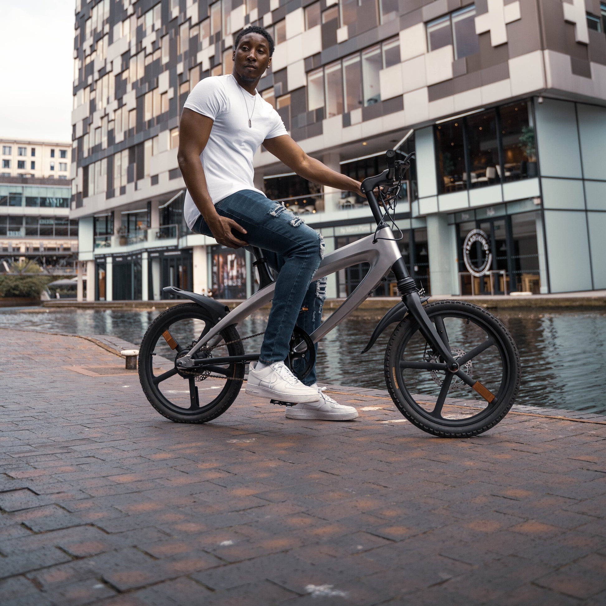 Cruzaa Carbon Black Electric Bike Water View